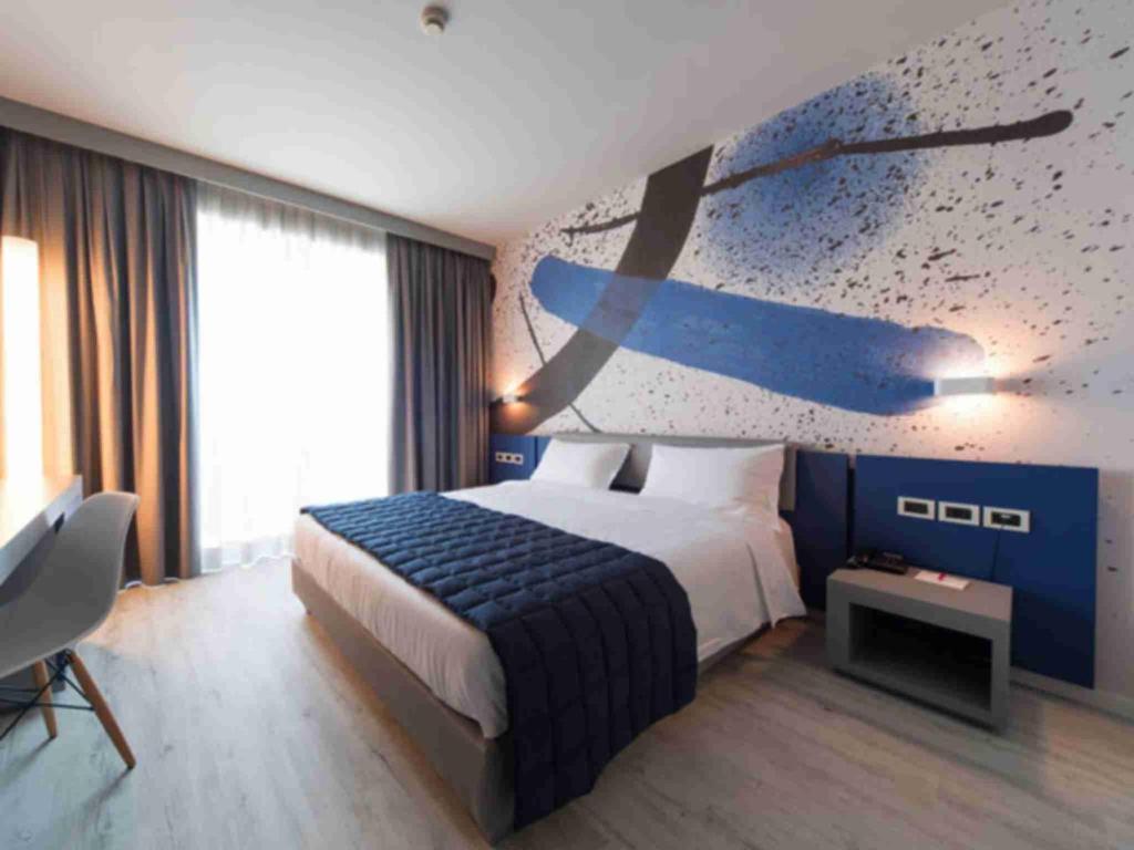 Postel nebo postele na pokoji v ubytování JR Hotels Gigli Firenze