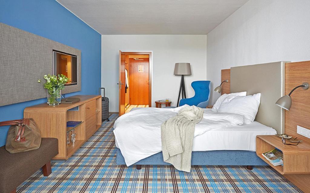 Postel nebo postele na pokoji v ubytování Seaside Residenz Hotel Chemnitz