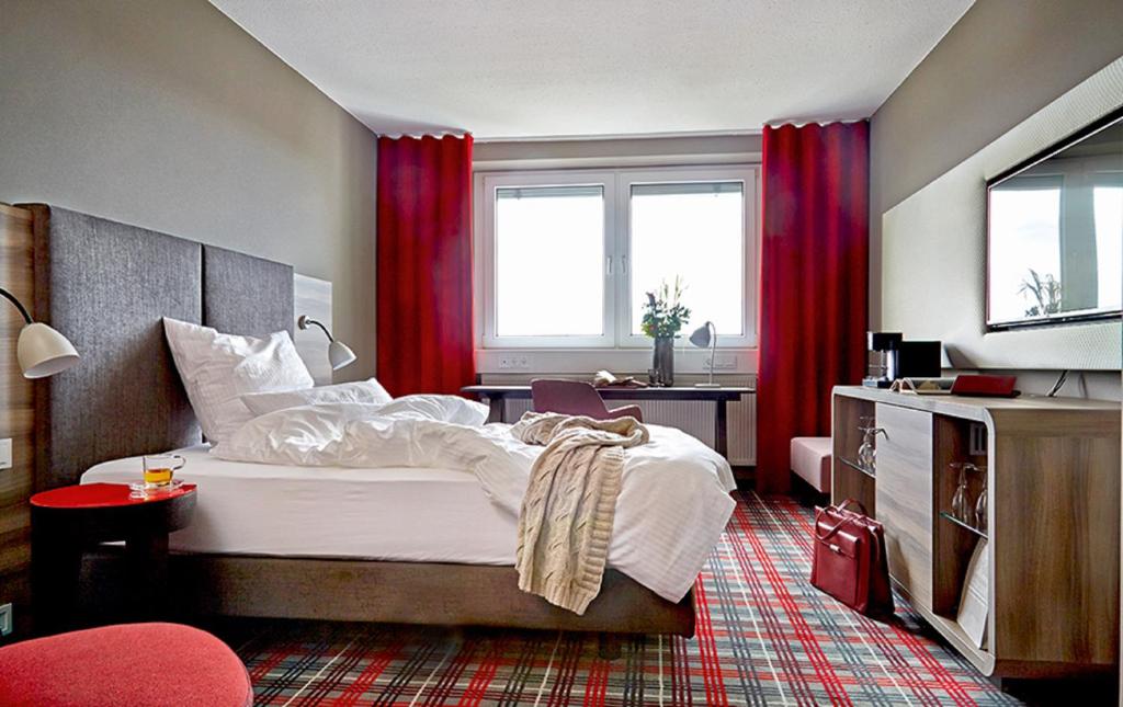 Postel nebo postele na pokoji v ubytování Seaside Residenz Hotel Chemnitz