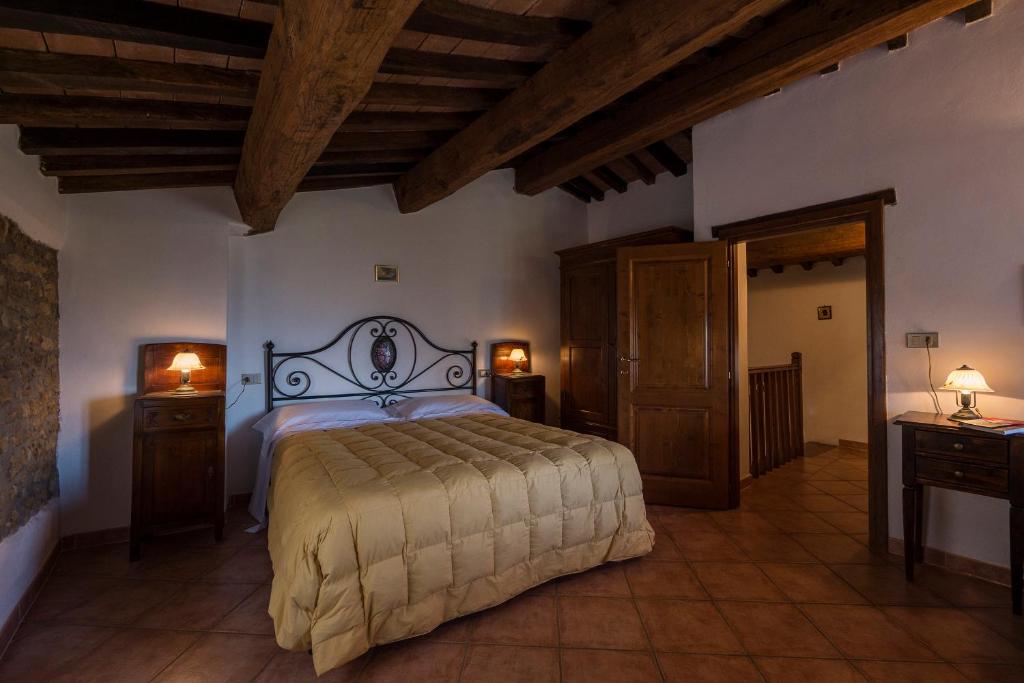 Postel nebo postele na pokoji v ubytování Agriturismo Monte Acuto