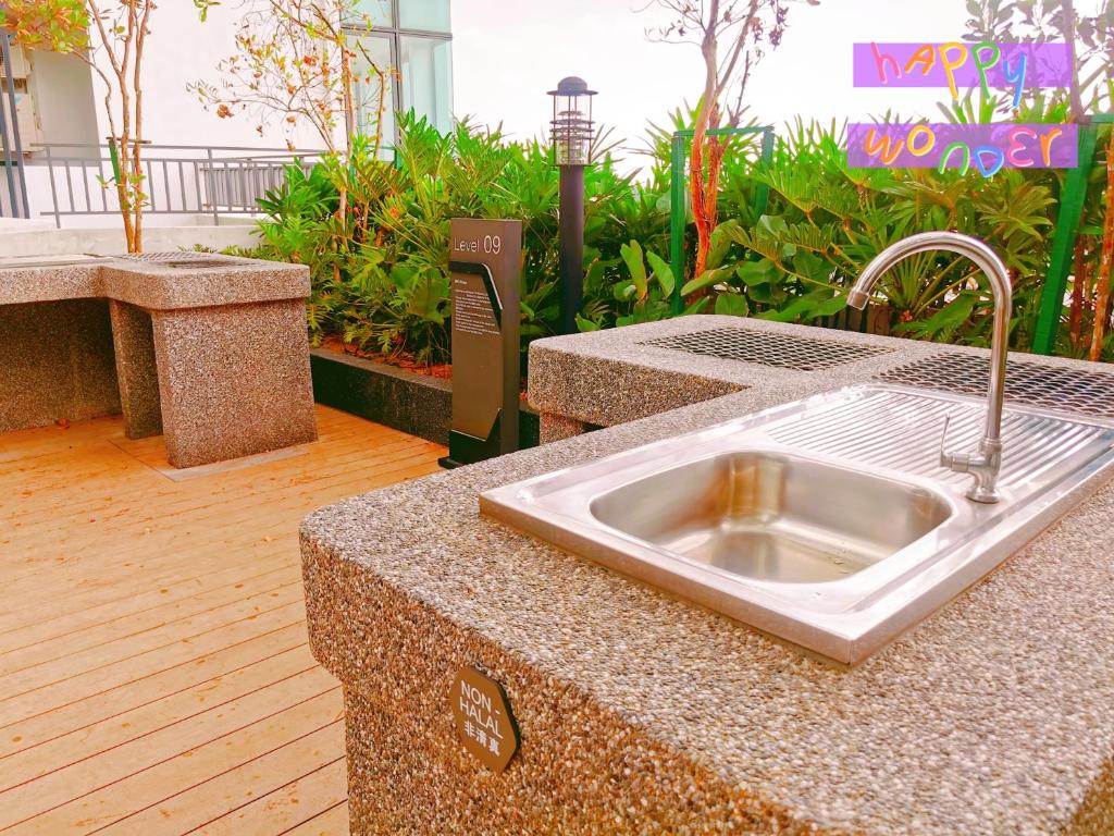 a kitchen counter with a sink in a building at NearEcobotanic & Legoland-HappyMoonlight-2B2R-8px in Iskandar Puteri