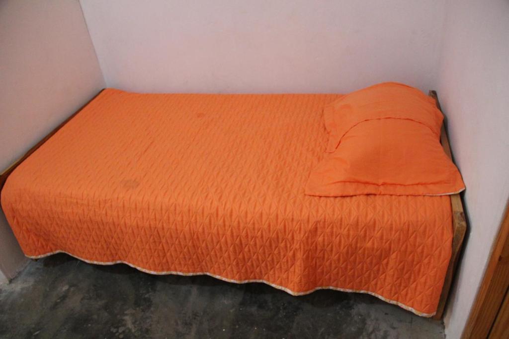 Postel nebo postele na pokoji v ubytování Hostal Mi Castillo