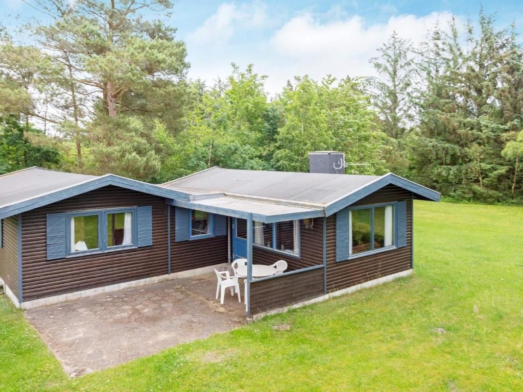 a tiny house with a solar roof on a yard at 5 person holiday home in Højslev-By Traum in Bøstrup