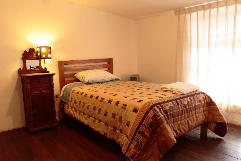 Postel nebo postele na pokoji v ubytování Emperatriz Guest House