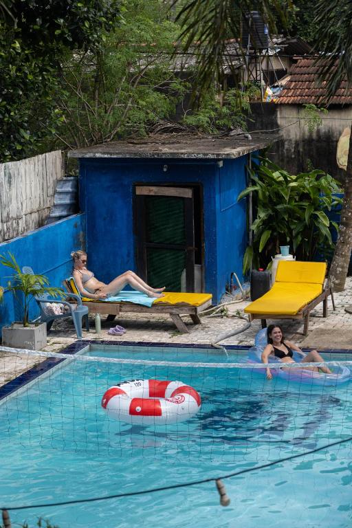 a group of people swimming in a swimming pool at Wake N Flow, Weligama in Weligama