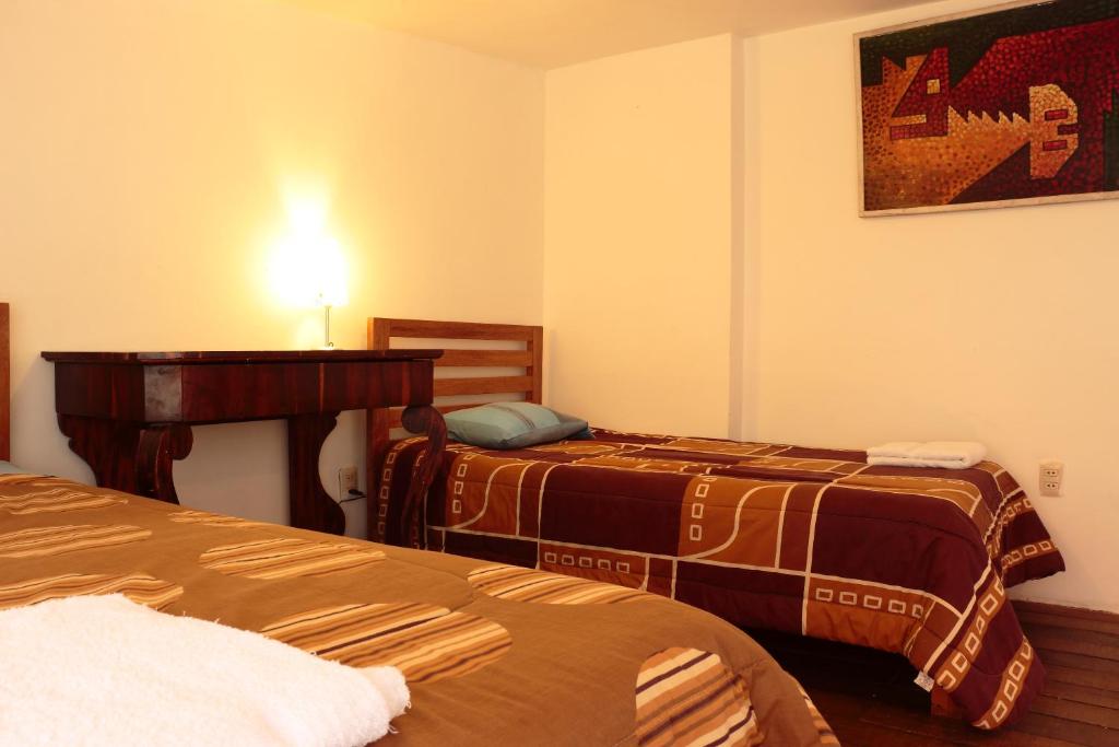 Postel nebo postele na pokoji v ubytování Emperatriz Guest House