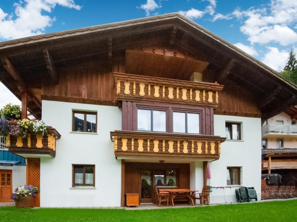 a large house with a wooden roof at Wohnung in Silbertal nahe Skilift in Silbertal