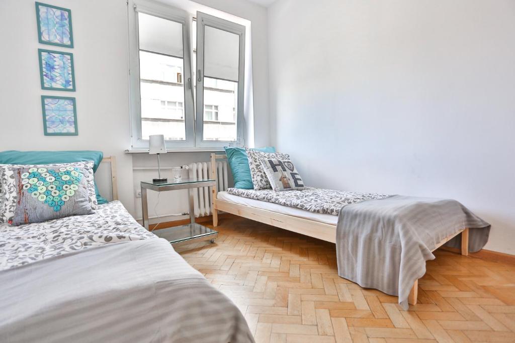 Posteľ alebo postele v izbe v ubytovaní Apartament Batory