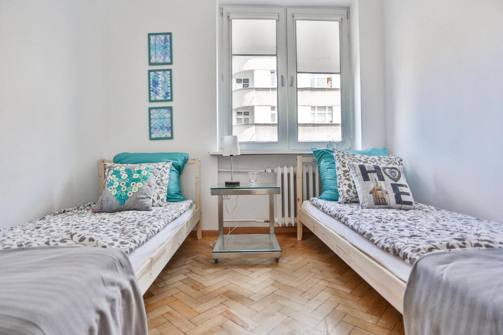 Posteľ alebo postele v izbe v ubytovaní Apartament Batory