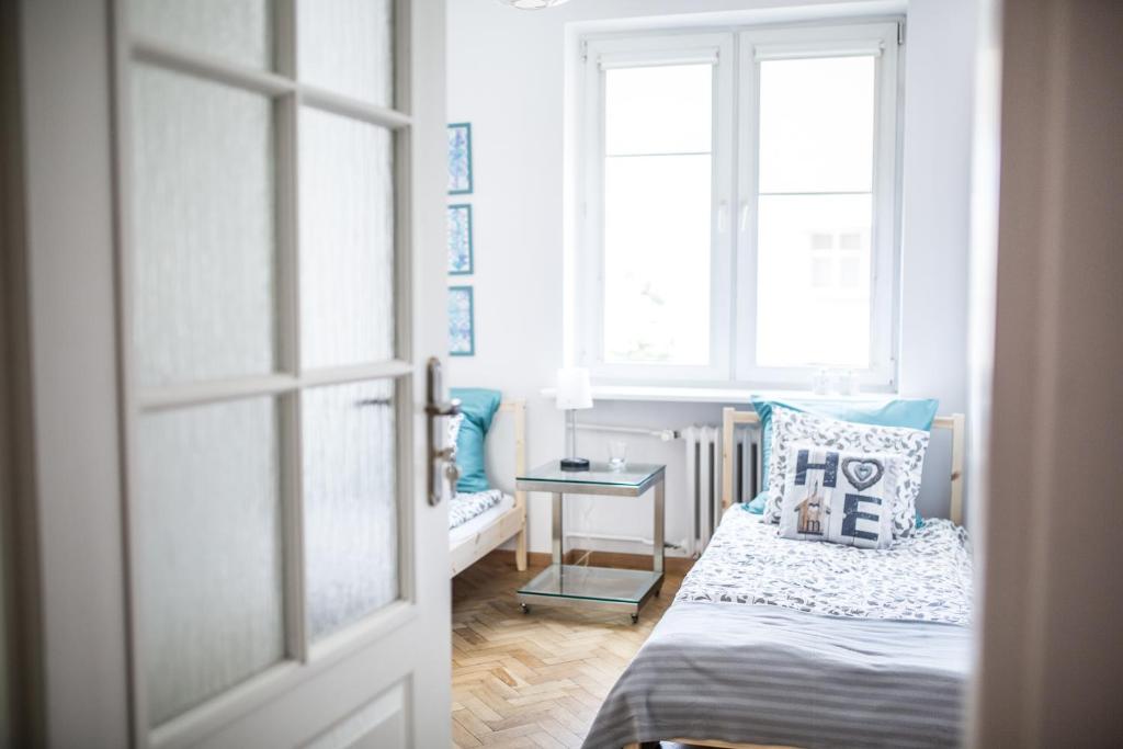 Posteľ alebo postele v izbe v ubytovaní Apartament Batory