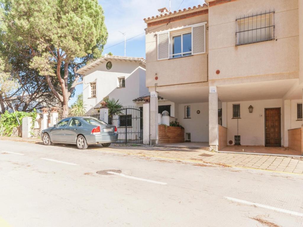 a car parked in front of a house at Sunny Terrace Near Beach in L'Escala