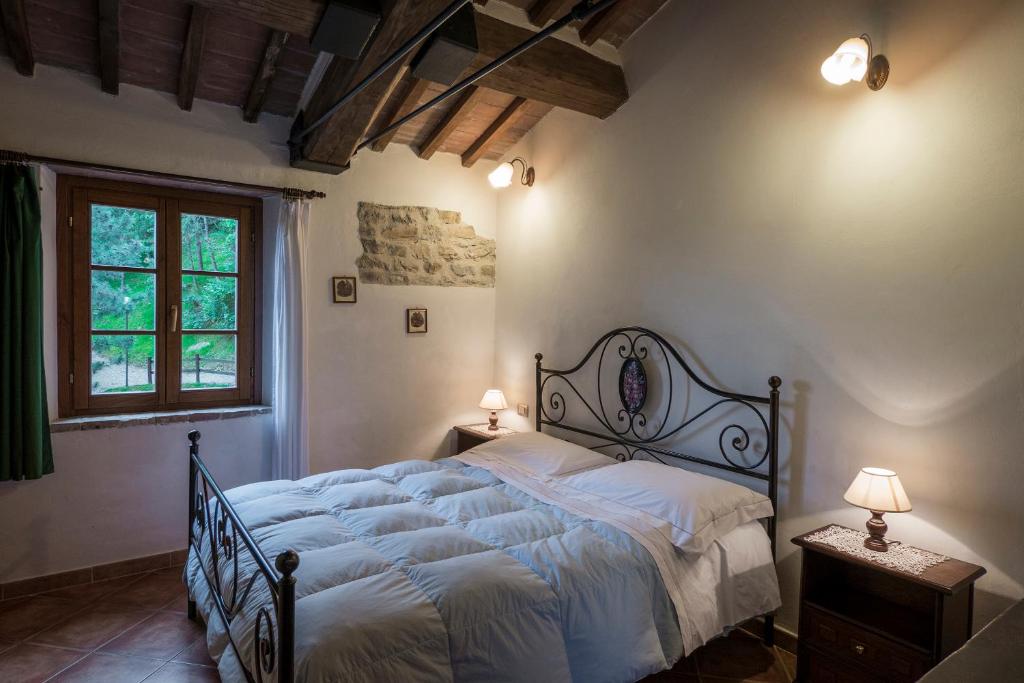 Postel nebo postele na pokoji v ubytování Agriturismo Monte Acuto