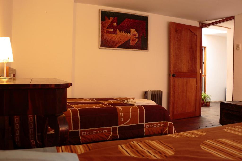 Postel nebo postele na pokoji v ubytování Emperatriz Guest House