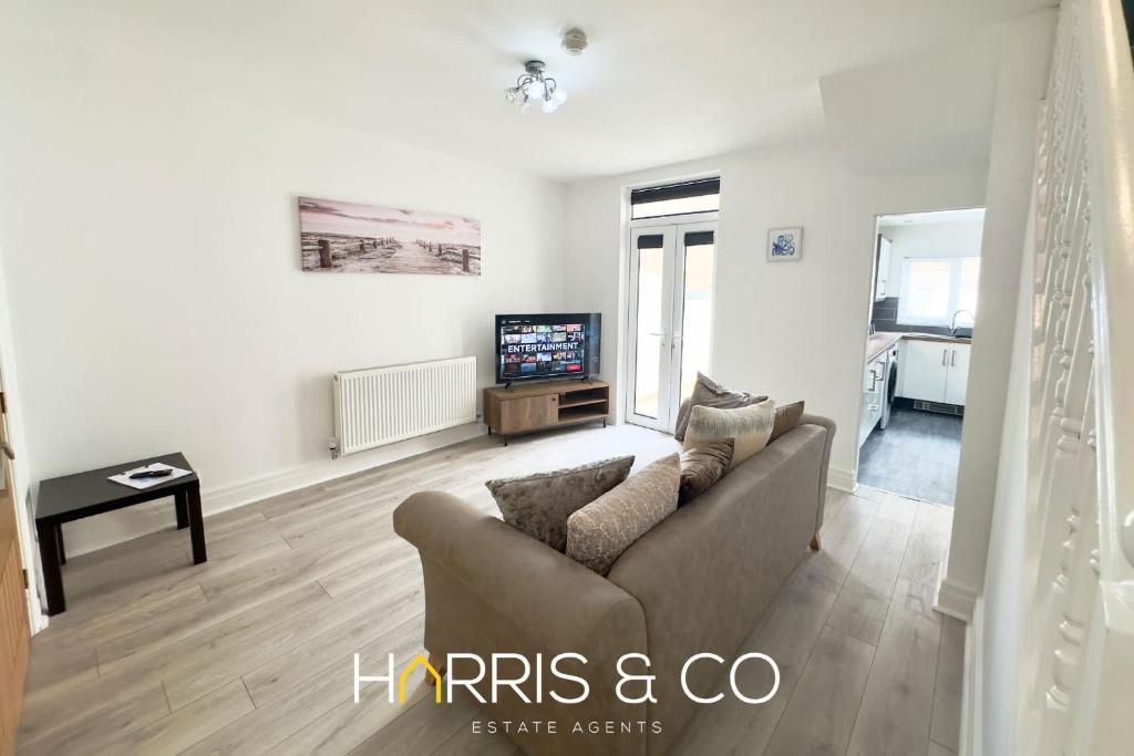a living room with a couch and a tv at Bosun's Bay in Fleetwood