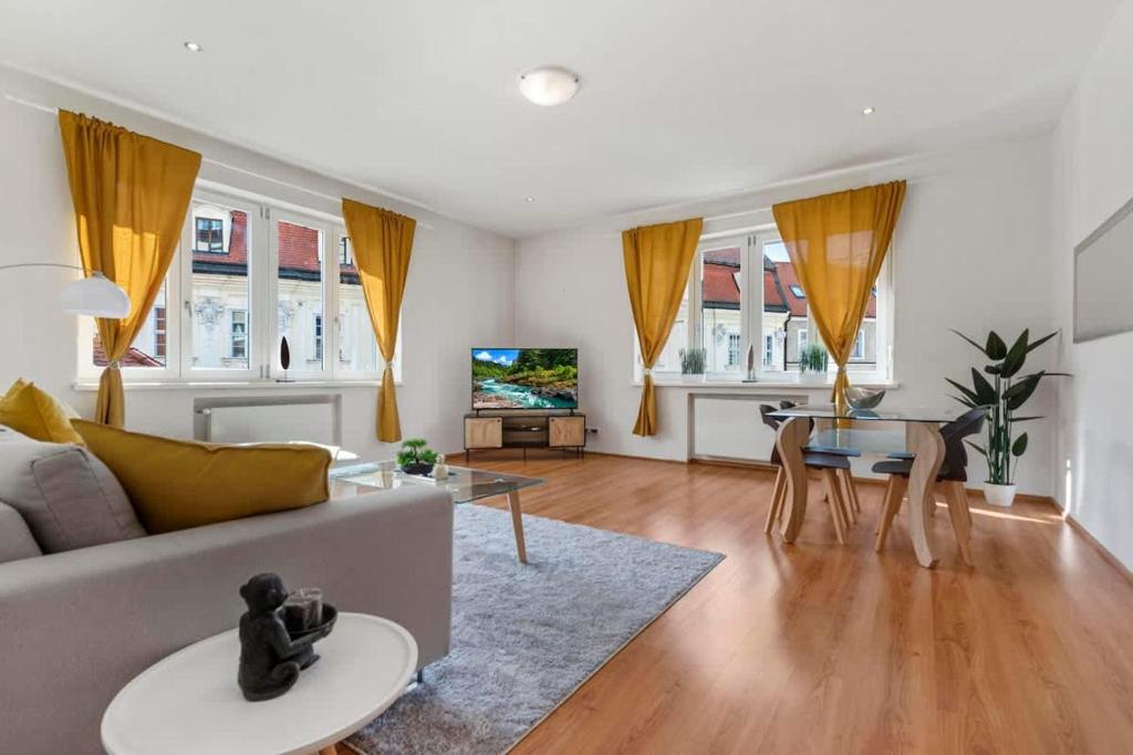 a living room with a couch and a table at Exclusive Apartment in Centre in Bratislava