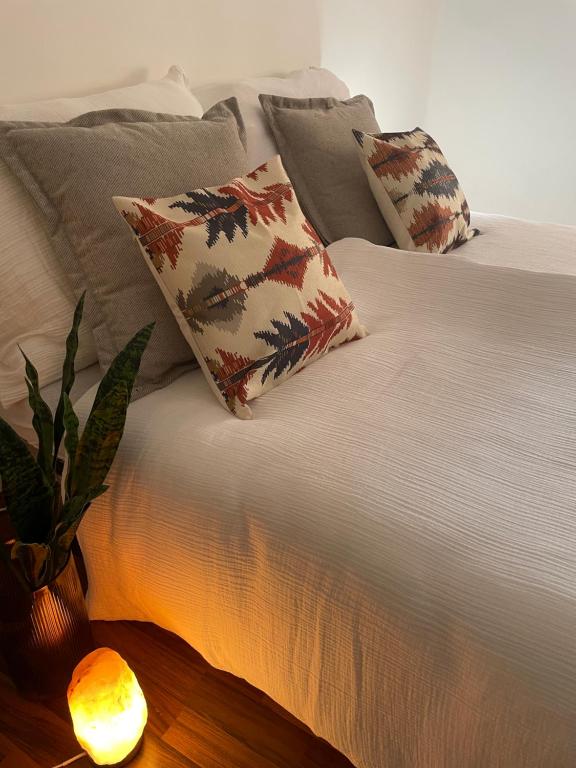 Ένα ή περισσότερα κρεβάτια σε δωμάτιο στο The Ozorian Guesthouse