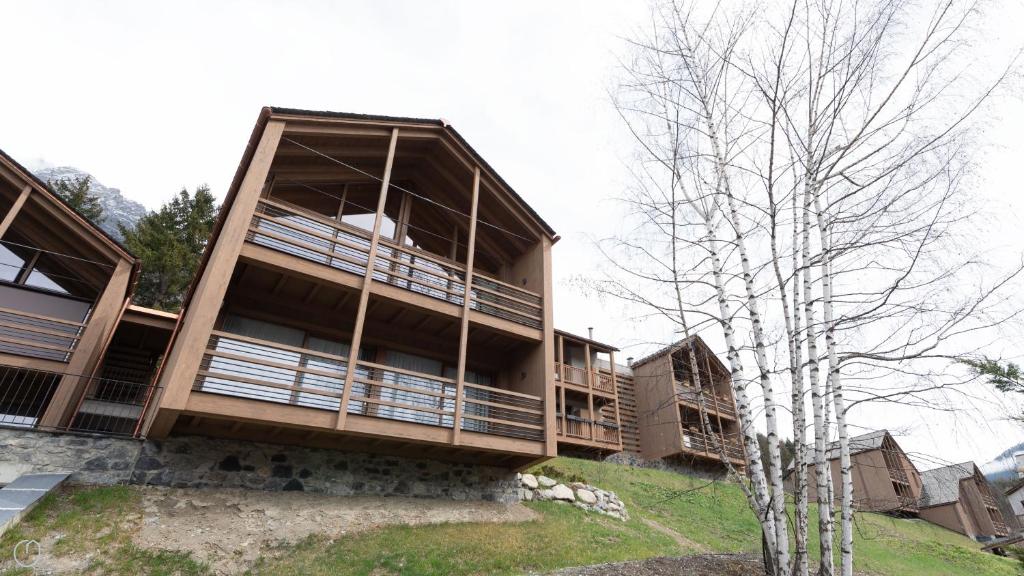 a building with balconies on the side of it at Dosso del Grillo 1A in Valdidentro