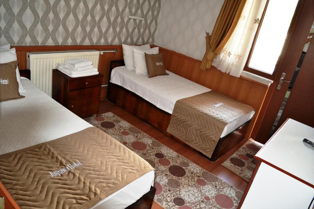 Giường trong phòng chung tại Aspawa Hotel