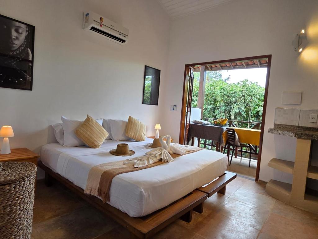 a bedroom with a large white bed in a room at Azul Flats in Jericoacoara