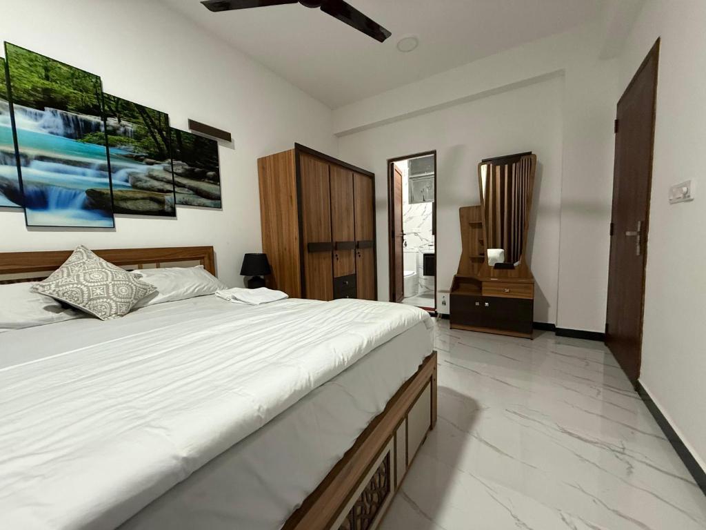 a bedroom with a large bed in a room at A-ONE Residency in Colombo