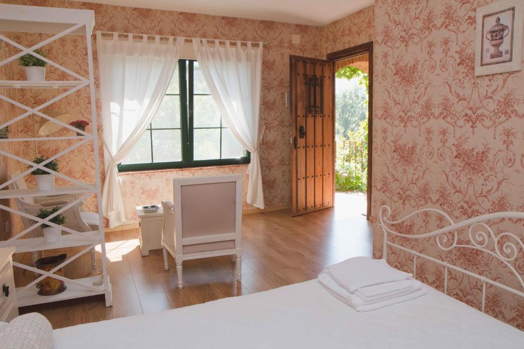 A bed or beds in a room at Finca El Carpintero