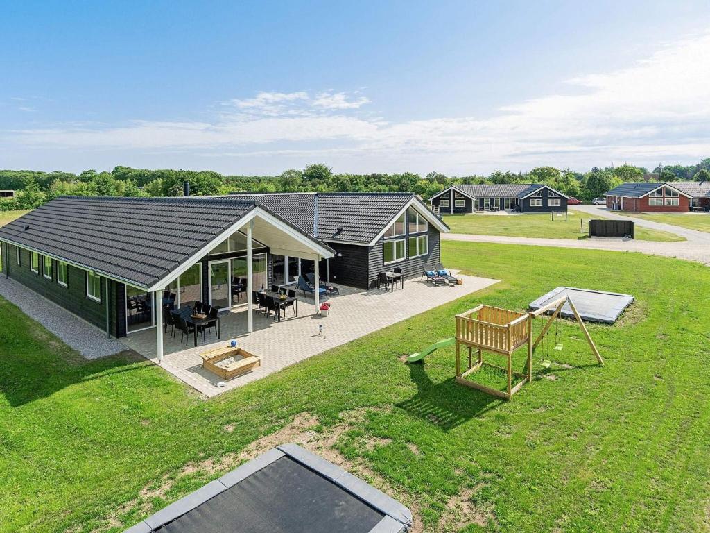 an aerial view of a house with a playground at 18 person holiday home in Grenaa in Grenå