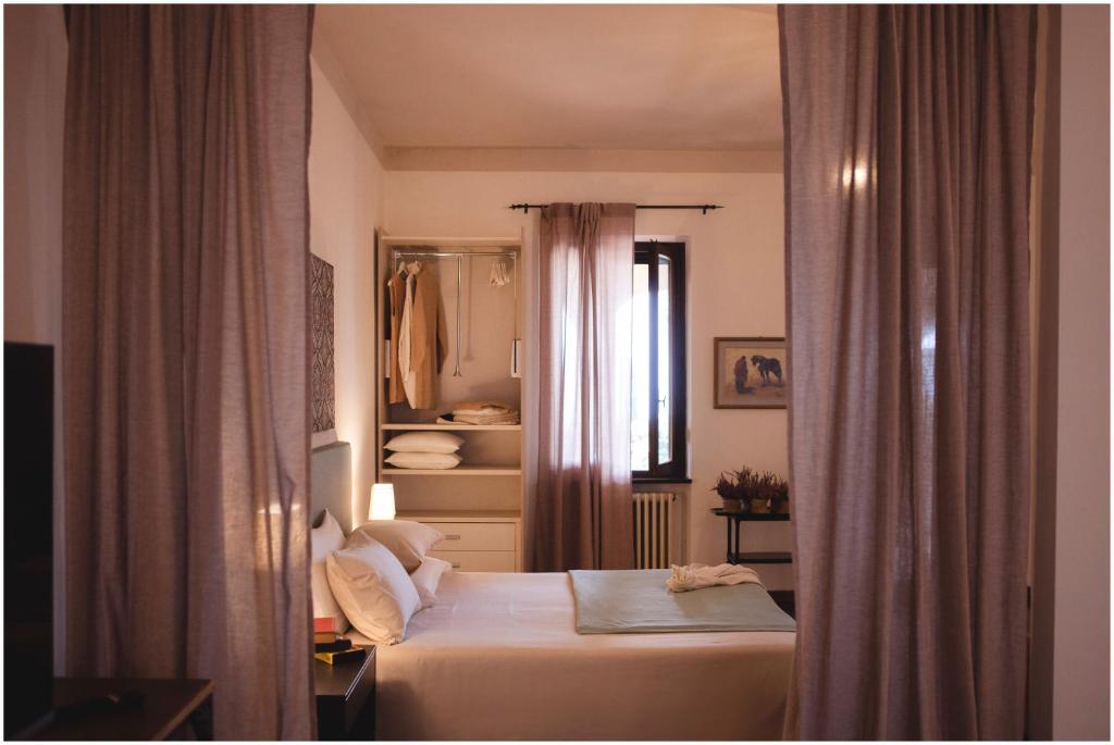 Ένα ή περισσότερα κρεβάτια σε δωμάτιο στο Bed and Breakfast Costa Etrusca