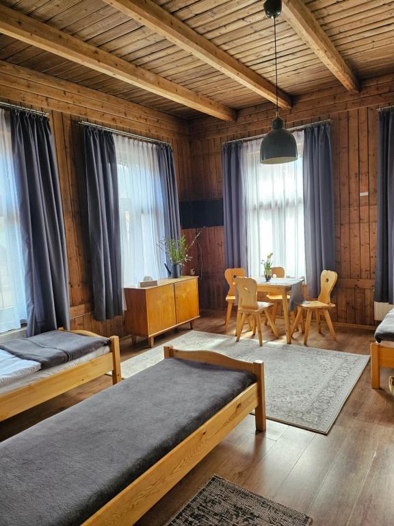 Ένα ή περισσότερα κρεβάτια σε δωμάτιο στο Niespodzianka