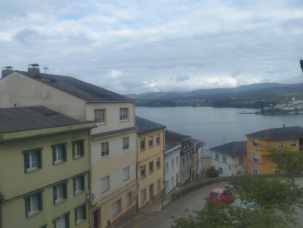 a view of a city with buildings and a lake at Piso Ría de Ribadeo in Ribadeo
