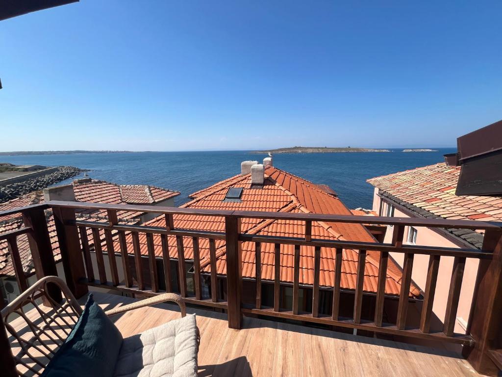 a balcony with a view of the water at Къща за гости Сирената in Sozopol