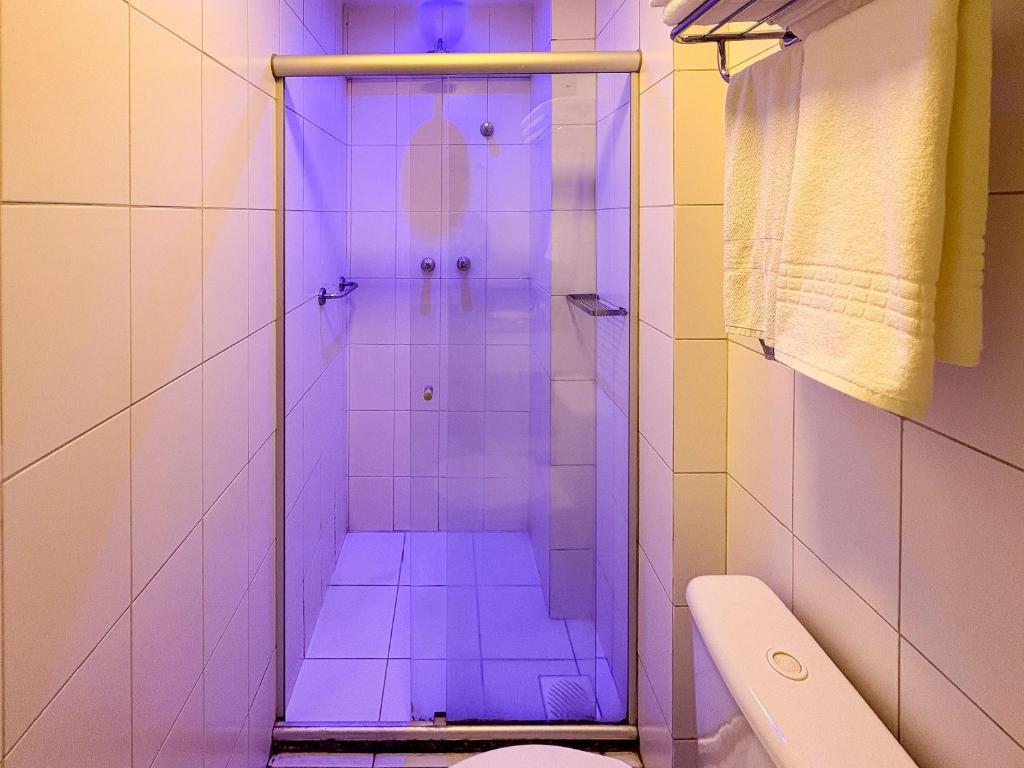 a bathroom with a shower with purple lights in it at Celita Franca - WS Urban in Feira de Santana