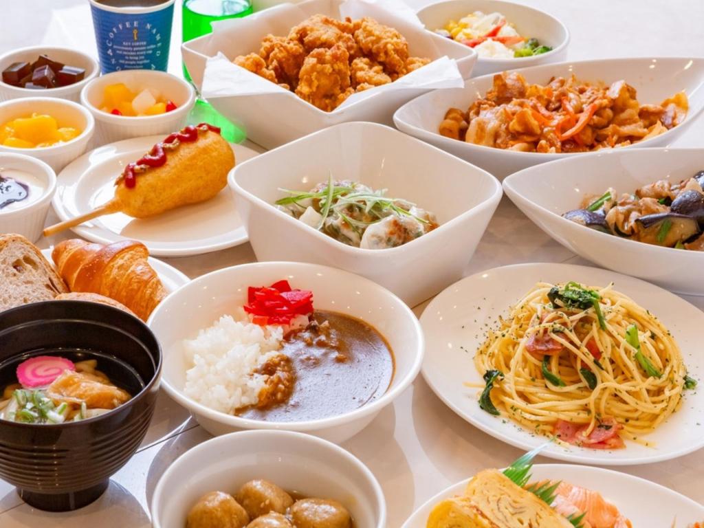 a table full of plates of food on a table at Smile Hotel Kushiro - Vacation STAY 10575v in Kushiro