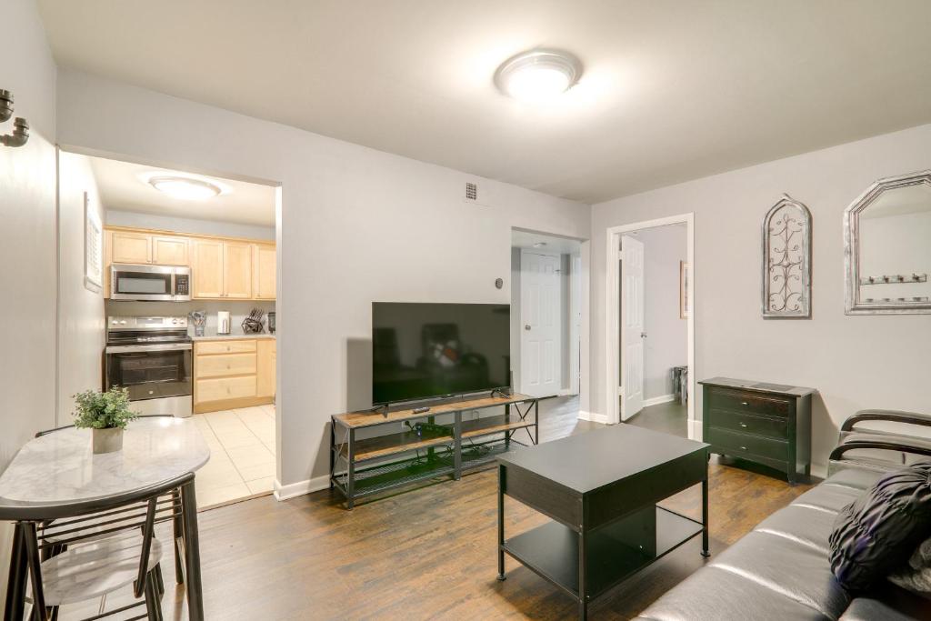 a living room with a couch and a table at 1 Mi to Dtwn and UGA Condo with Pool in Athens! in Athens