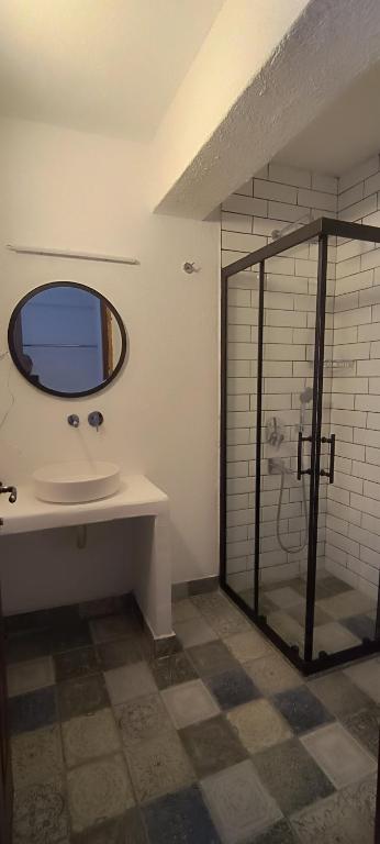 a bathroom with a sink and a shower with a mirror at Dut Selimiye in Marmaris