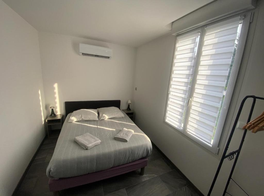 Ένα ή περισσότερα κρεβάτια σε δωμάτιο στο Studio cosy