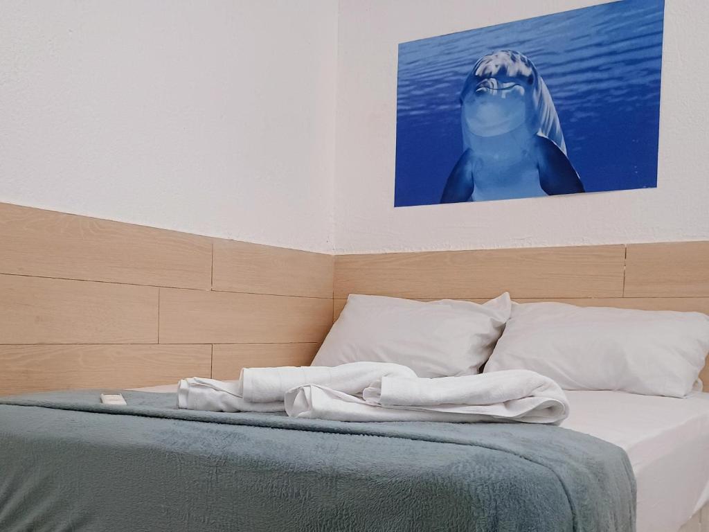 Ένα ή περισσότερα κρεβάτια σε δωμάτιο στο Hotel Dolphin Fortaleza
