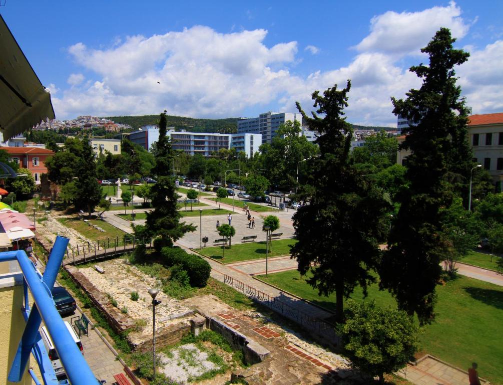 a view of a park with trees and buildings at RentRooms Thessaloniki in Thessaloniki