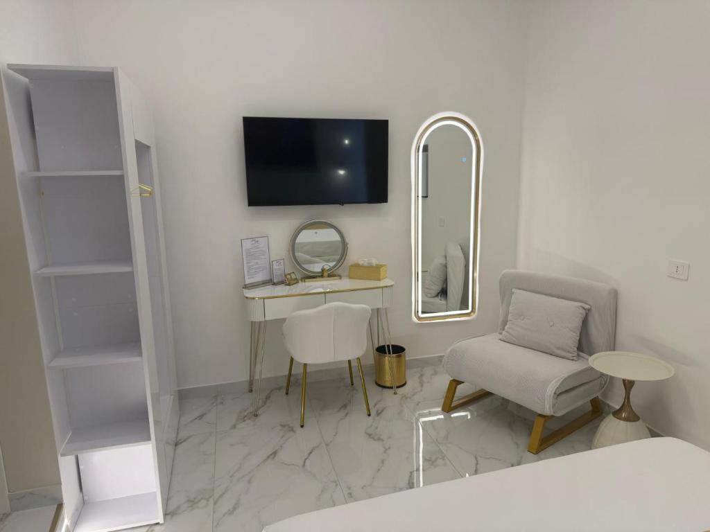 TV a/nebo společenská místnost v ubytování Belle Ame Suites