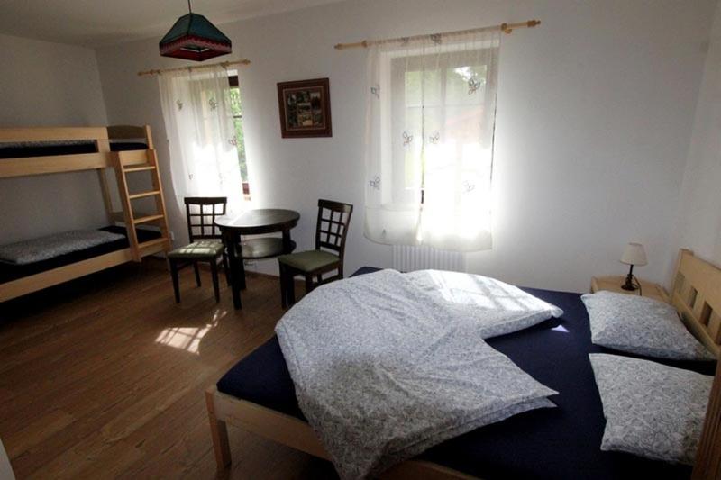 Postel nebo postele na pokoji v ubytování Penzion Adršpach u Báry