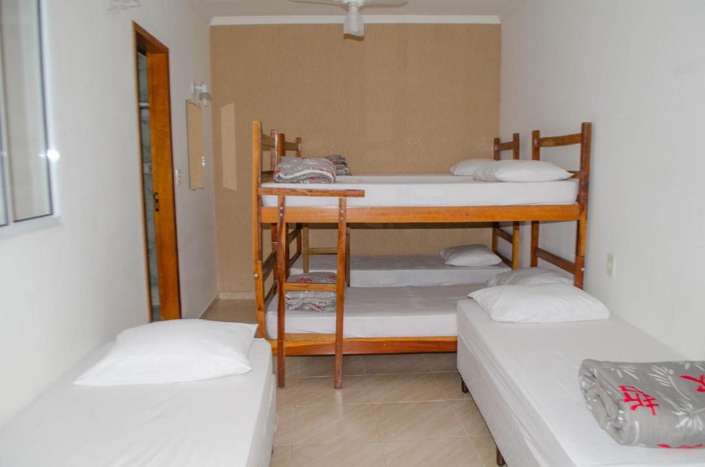 En eller flere senge i et værelse på POUSADA SÃO MATHEUS - Casa e Hospedagem