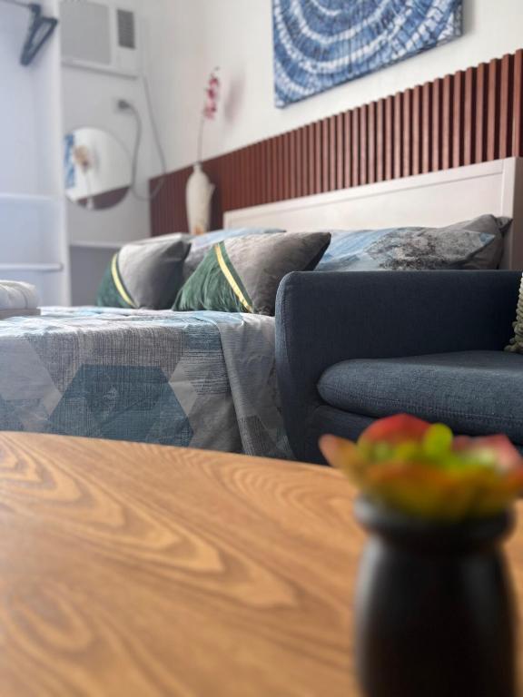 a living room with a couch and a table at Iloilo Condo Perfect for Couple in Iloilo City