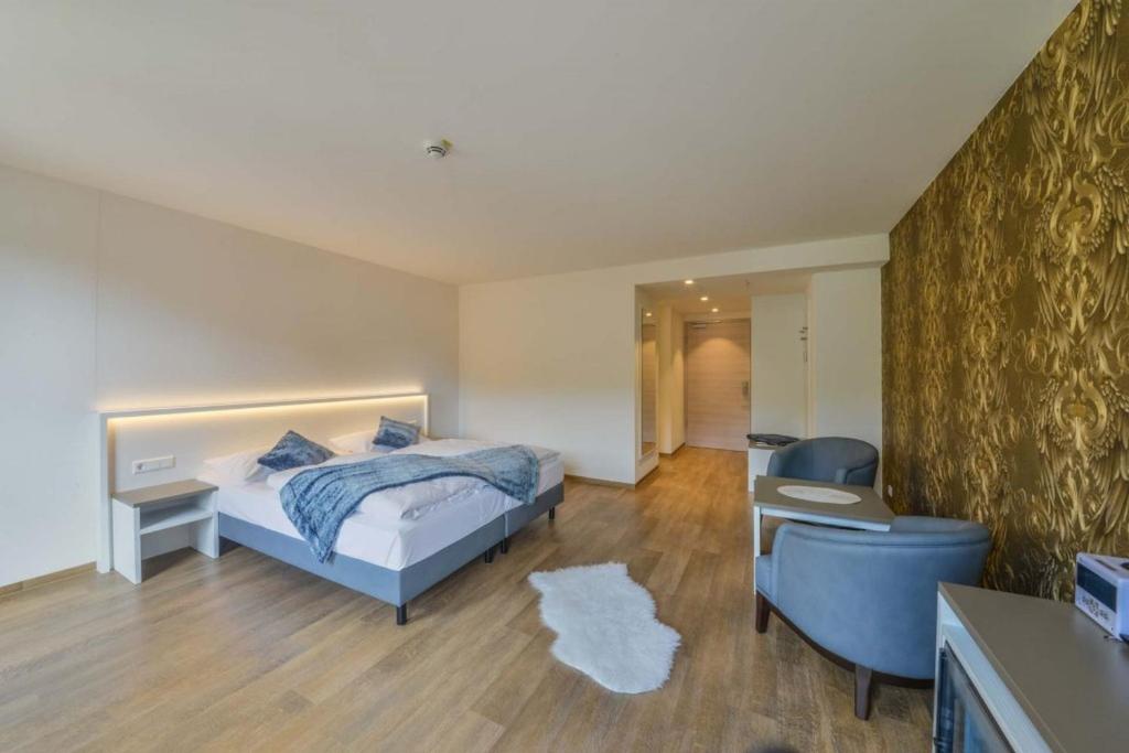 Postel nebo postele na pokoji v ubytování Hotel Gasthof Heckl