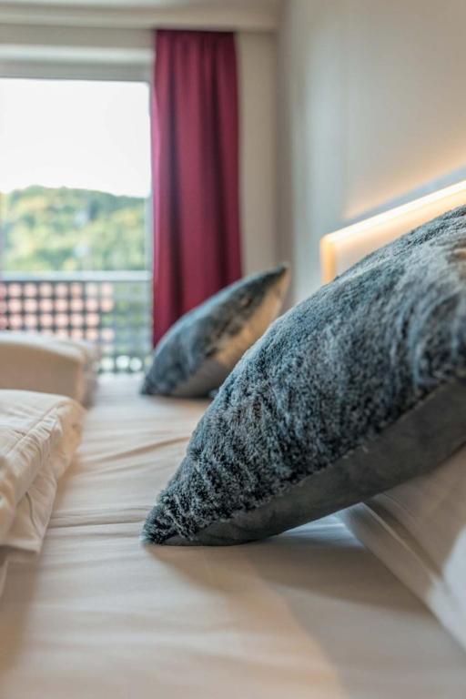 Postel nebo postele na pokoji v ubytování Hotel Gasthof Heckl