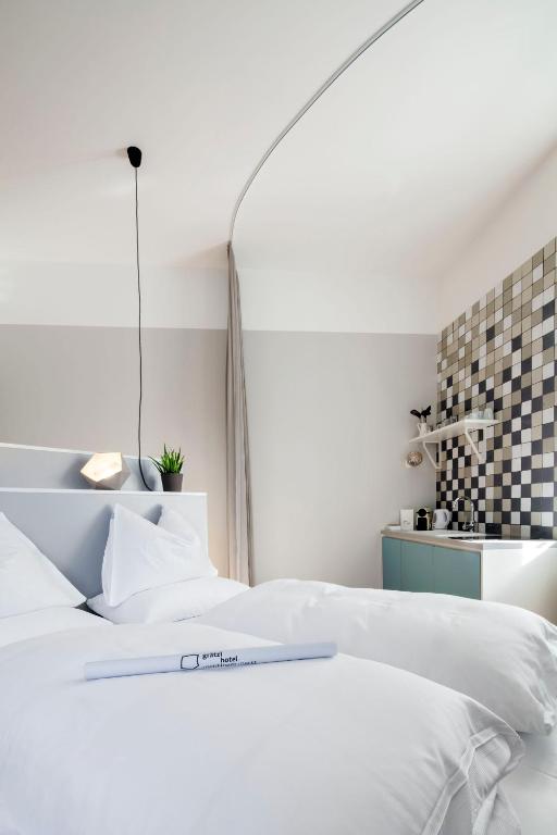 Postel nebo postele na pokoji v ubytování grätzlhotel Schönbrunn