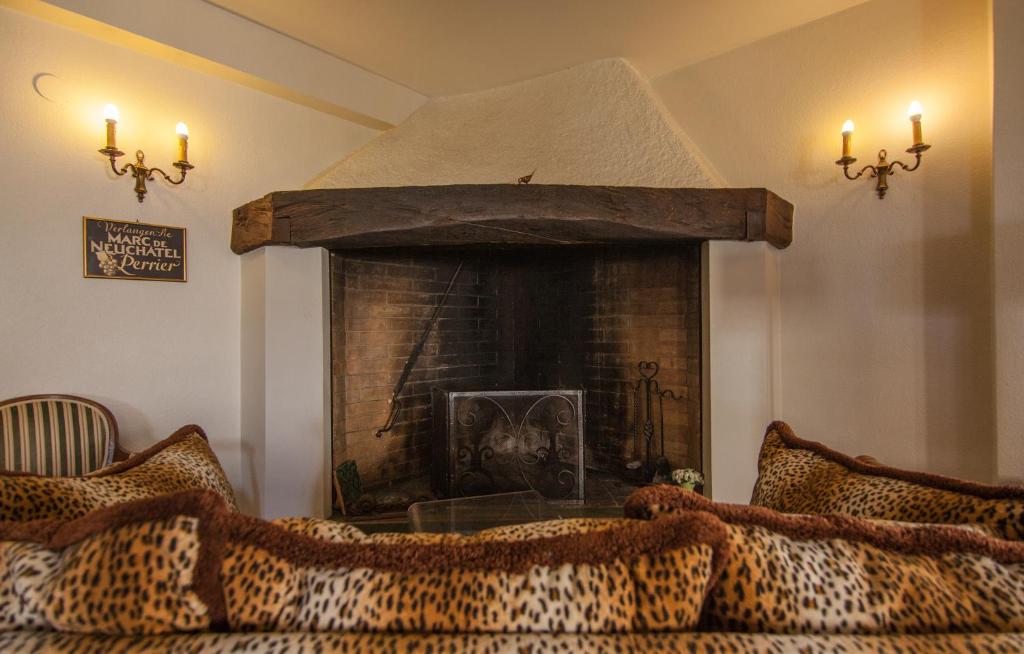 Un lugar para sentarse en Hôtel Les Vieux Toits