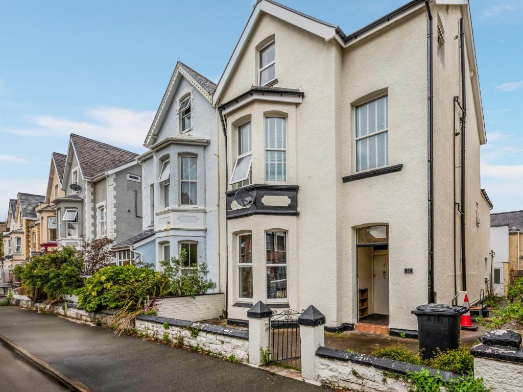a row of houses on a city street at Sea Shore Flat in Llandudno
