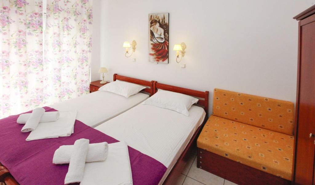 Postel nebo postele na pokoji v ubytování Nereids Apartments and Studios
