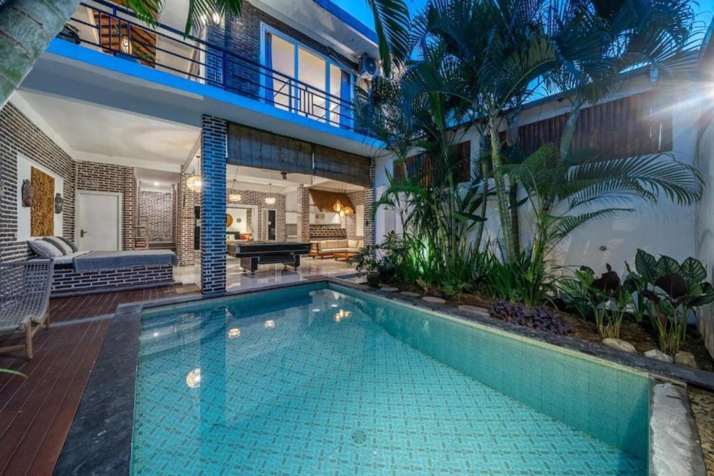 a swimming pool in the middle of a house at Luxury 3-Bedroom Pool Villa in Canggu Near Beach & Nightlife in Canggu
