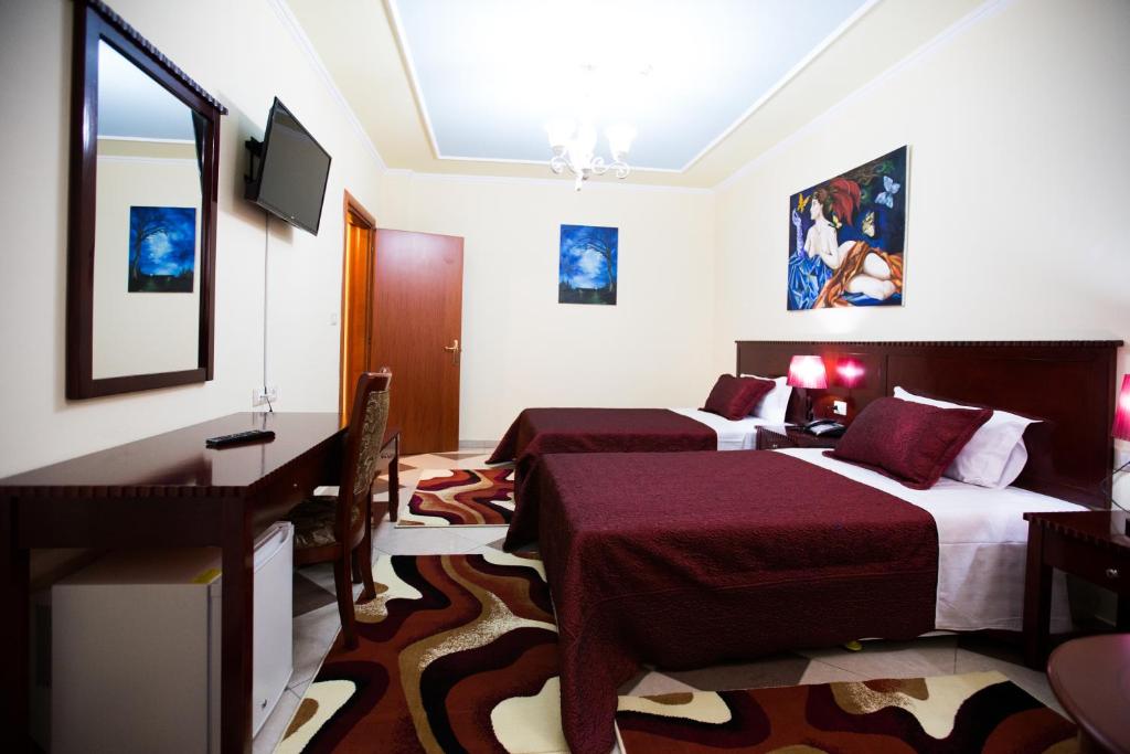 TV a/nebo společenská místnost v ubytování Orchidea Hotel