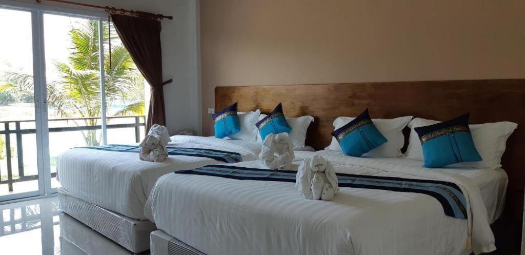 Postel nebo postele na pokoji v ubytování Hadthong Resort